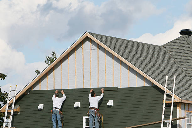 Professional Storm Damage Siding Repair technician working in Alliance, OH